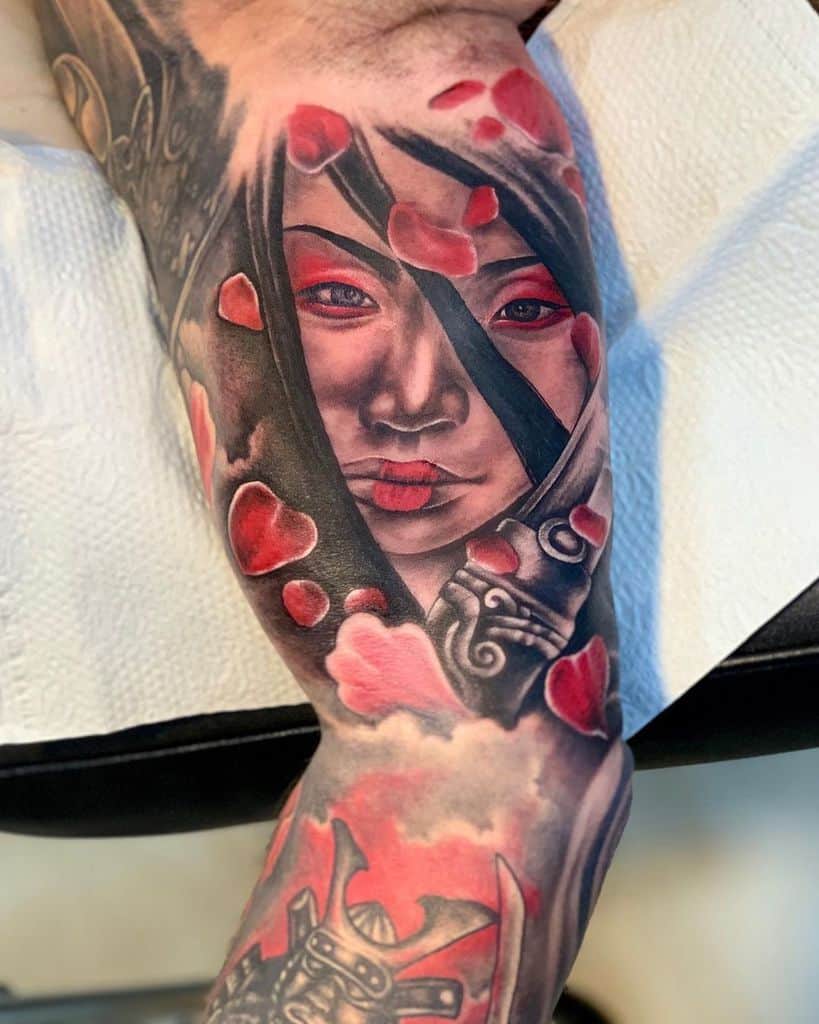 Realistic tattoo of a warrior Geisha with red accents, peering through a torn veil, surrounded by falling petals and samurai armor details.