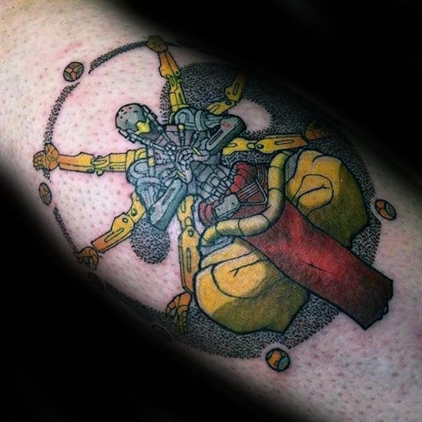 Detailed color tattoo of Zenyatta from Overwatch in a meditative pose with golden mechanical arms and orbs in a mandala-like design.
