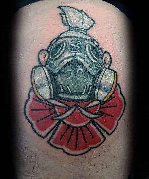 Traditional-style tattoo of Roadhog from Overwatch featuring his iconic gas mask and red fan collar, inked on the upper thigh.