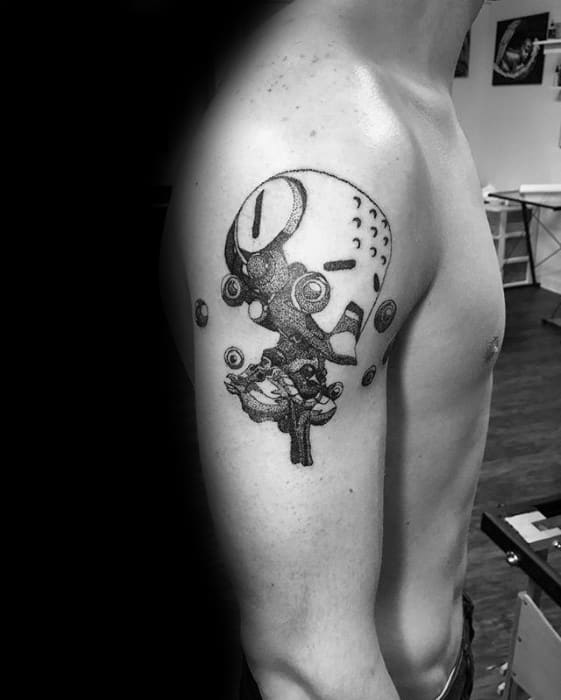 Black and grey dotwork tattoo of Zenyatta from Overwatch, shown meditating with floating orbs on the upper arm.