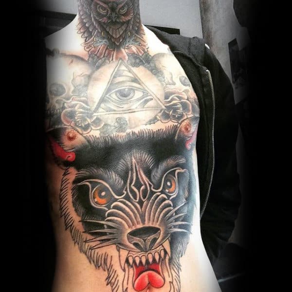Throat and chest tattoo featuring a menacing owl, an all-seeing eye within a pyramid, and a fierce black wolf with fiery orange eyes