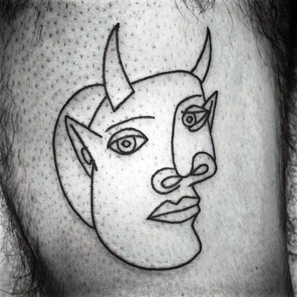 Minimalist tattoo of a Picasso-style devilish face, with horns, sharp ears, abstract features, and continuous bold linework.