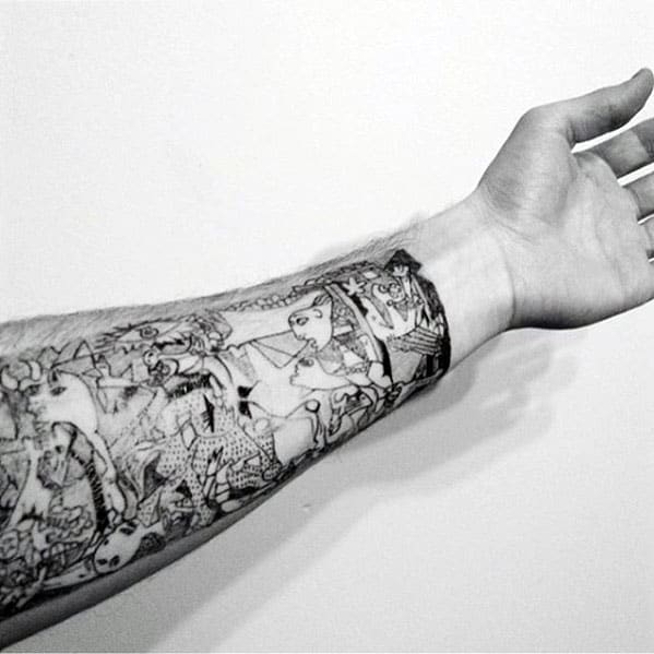 Detailed black and gray forearm tattoo of Picasso’s *Guernica*, wrapping around the arm with expressive, chaotic wartime imagery.