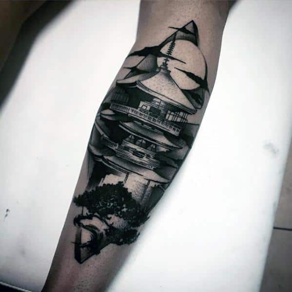 Black and grey forearm tattoo of a Japanese pagoda with stylized waves, birds in flight, and a tree silhouette for a bold, dynamic composition.