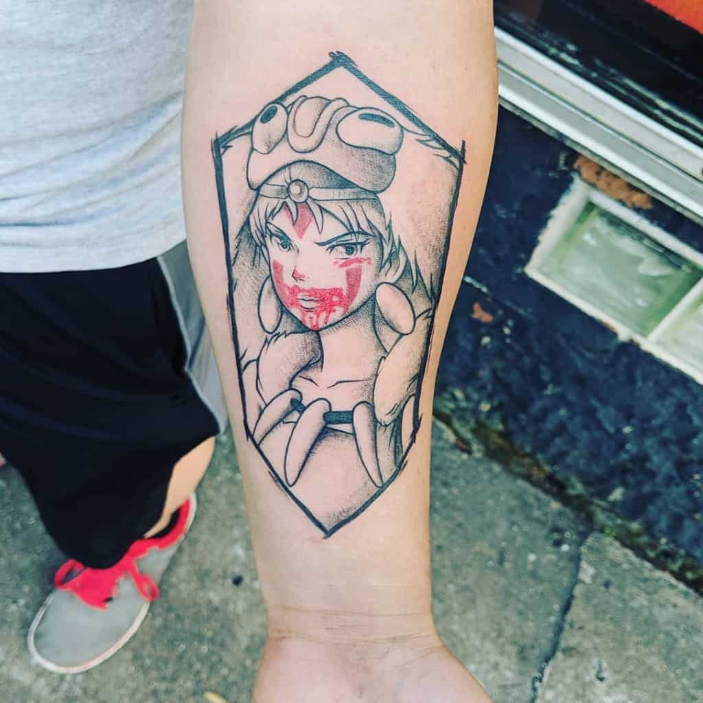 A minimalist tattoo of a woman with a wolf headdress, shown with bold face markings and blood stains around her mouth. The tattoo is framed within a geometric diamond shape, emphasizing her intense expression and strong presence.