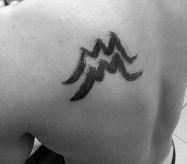 Paint Brush Stroke Aquarius Tattoo On Mans Back