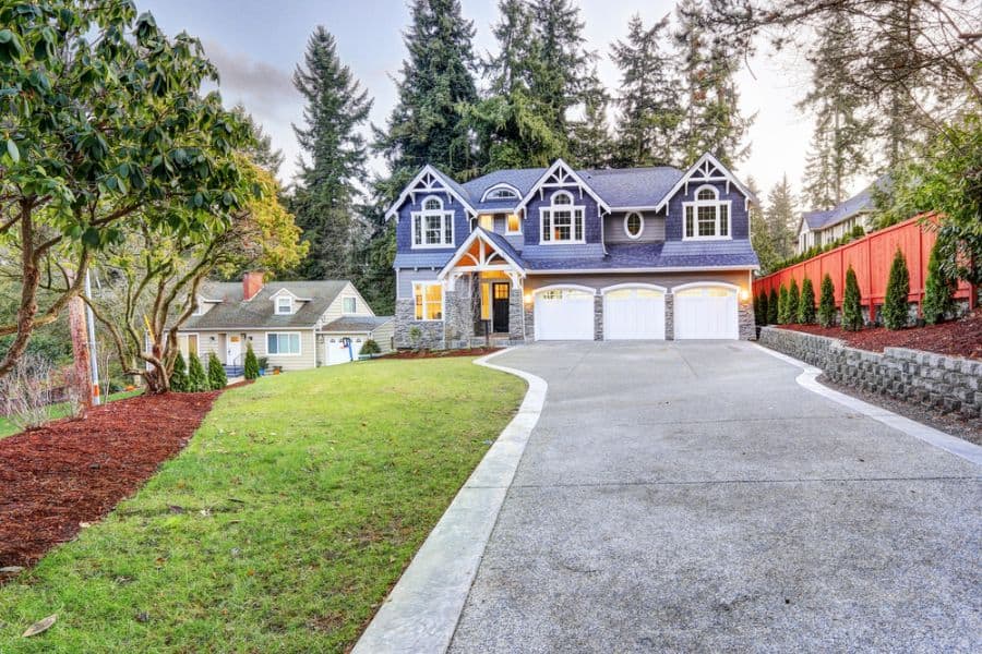 purple craftsman style home three garages