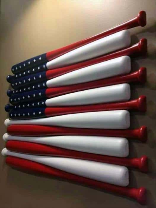Baseball bats arranged to resemble the American flag, with stars and stripes painted in red, white, and blue