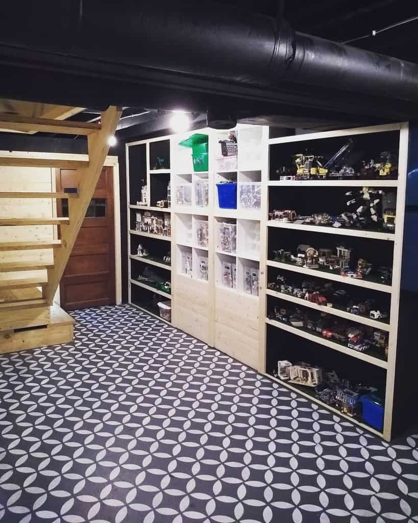 Basement storage area with patterned tile flooring, wooden shelving, and toy display setup.