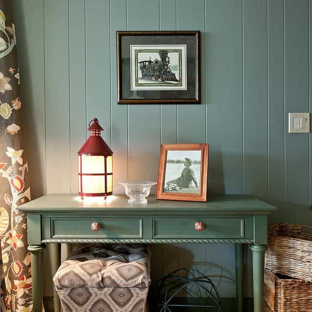 green wall paneling small desk