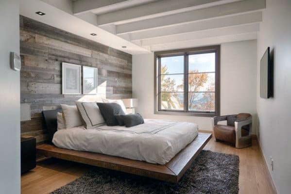 Painted White Drywall With Reclaimed Wood Accent Wall In Master Bedroom