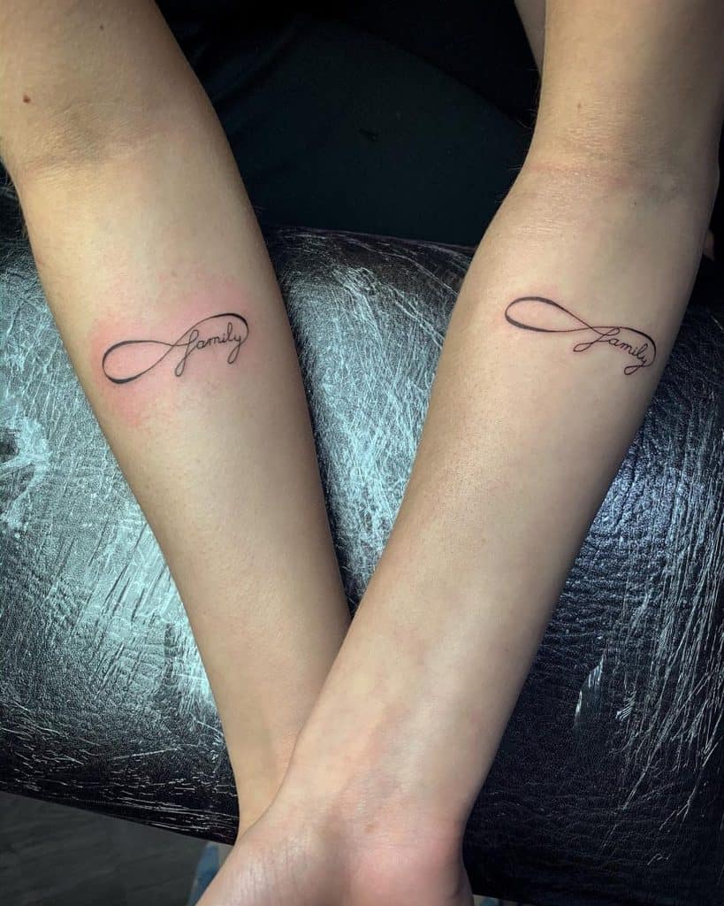 A heartfelt infinity tattoo featuring the word "family" embedded within the loop, symbolizing an everlasting bond.