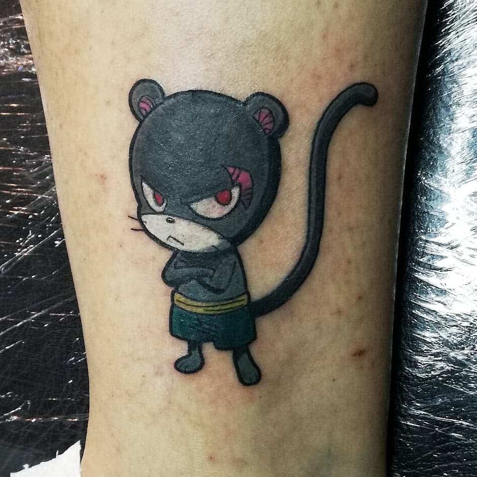 Colorful tattoo of Panther Lily from Fairy Tail, featuring his signature serious expression, crossed arms, and bold black and red details.