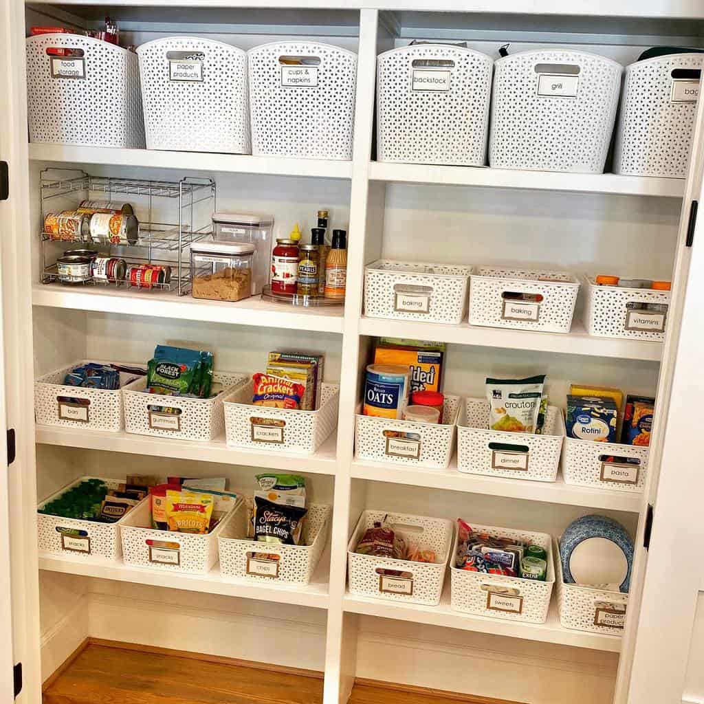 white pantry kitchen with organized shelves and baskets