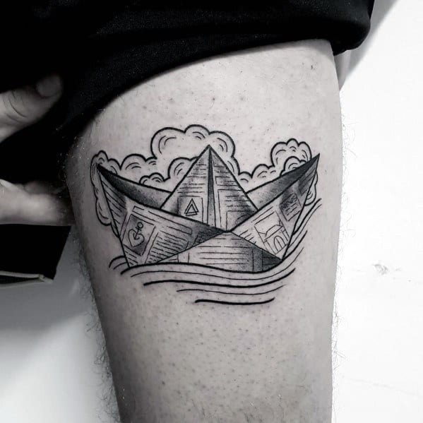 Detailed paper boat tattoo made of newspaper, floating on waves with clouds, symbolizing nostalgia, adventure, and storytelling.