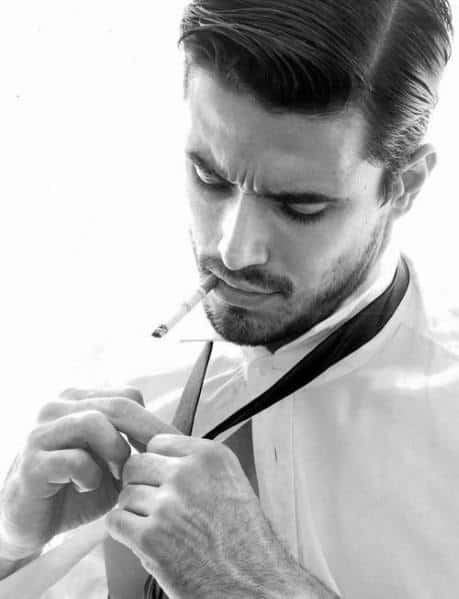 Classic side part with a sleek, polished finish and medium length