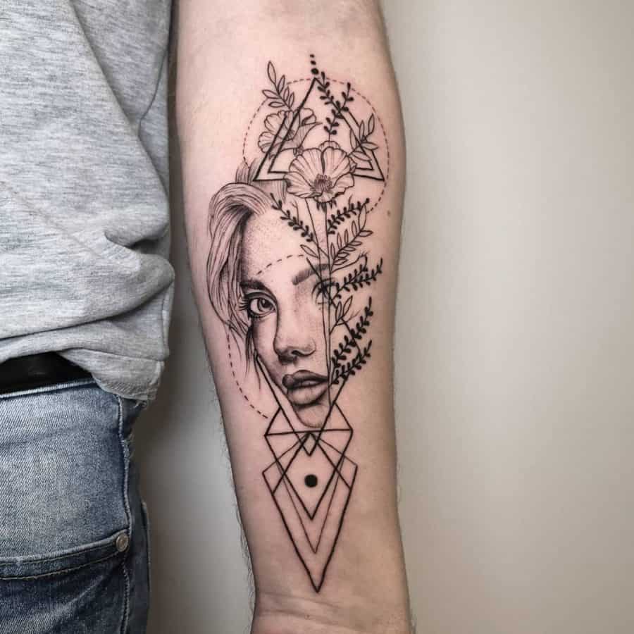 Forearm tattoo featuring a woman's face merging with floral and geometric elements, blending realism with intricate line work.