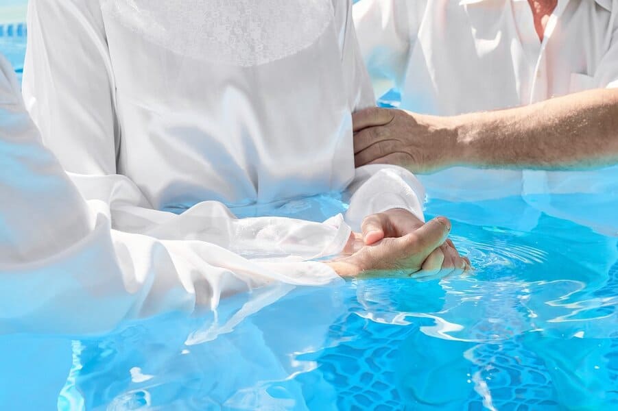 pastors baptizing woman
