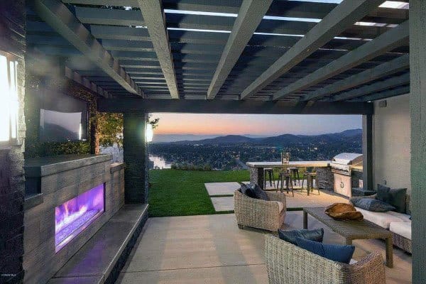 luxury concrete patio fireplace city view