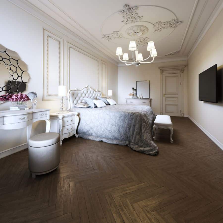 Regal white bedroom featuring Renaissance-style furniture, elegant decor, and herringbone flooring.