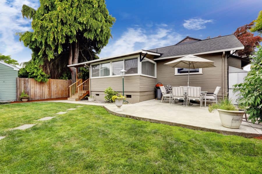 large backyard with concrete patio