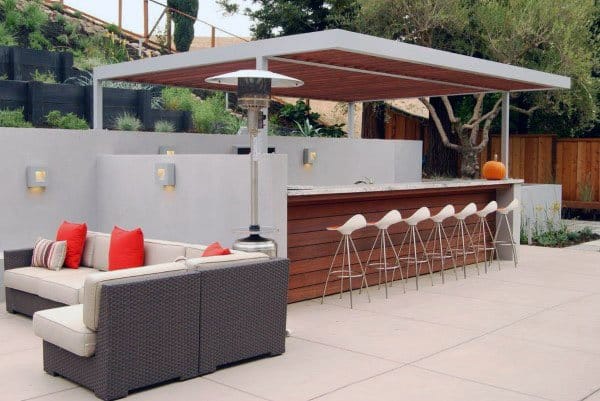 Modern outdoor pavilion bar with sleek counter seating, lounge area, and minimalist design.