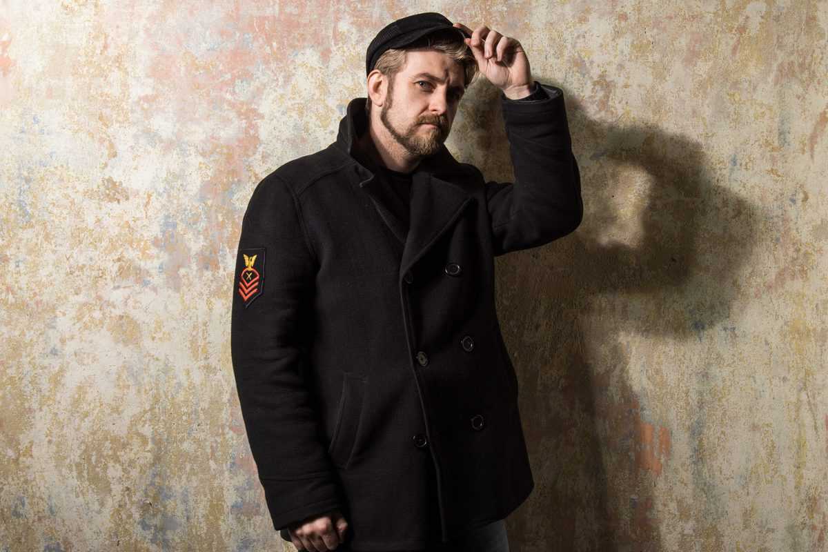Attractive,Young,Bearded,Man,In,A,Pea,Coat,And,Cap