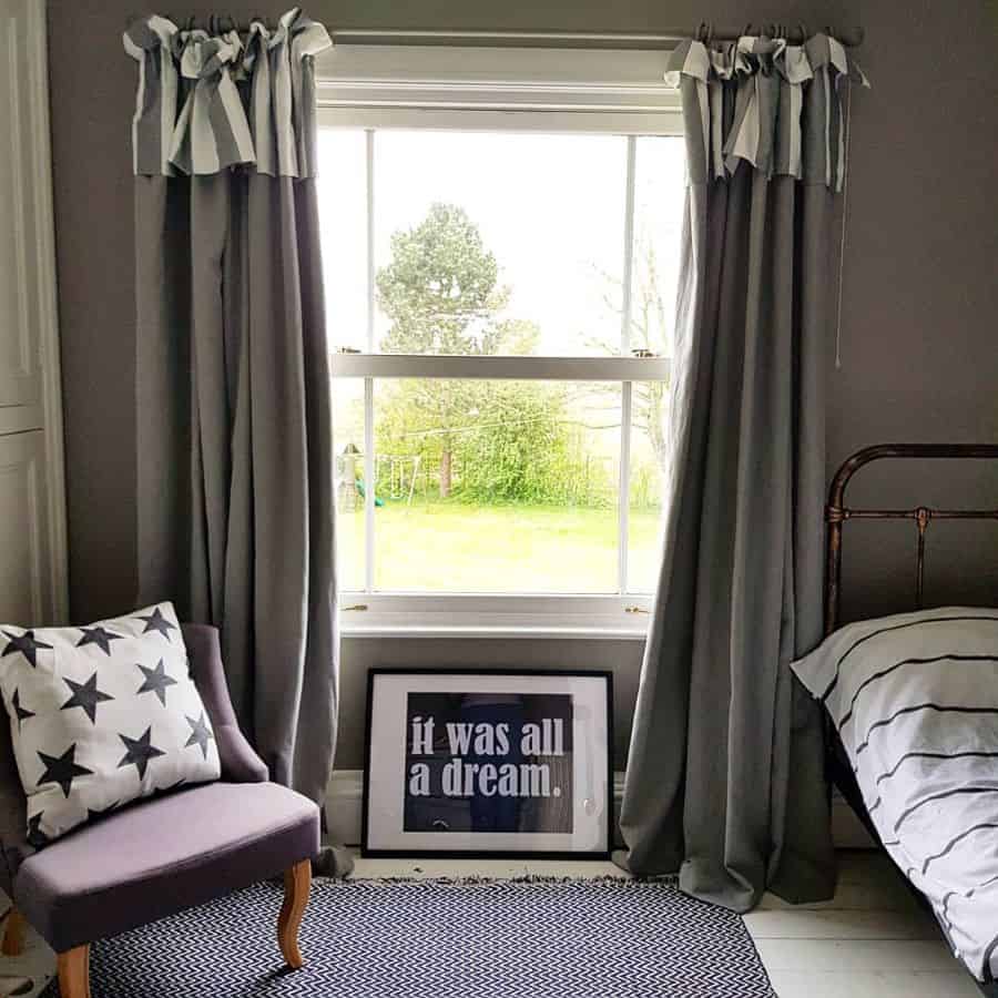 Gray bedroom curtains with striped valance, "It was all a dream" poster.