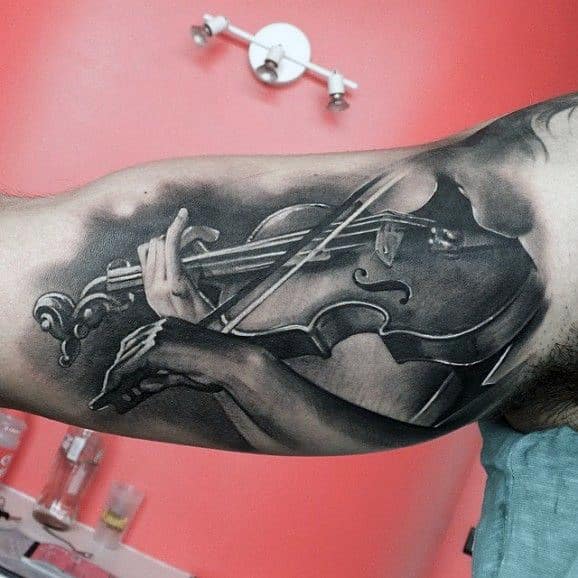 Pencil Art Man Playing Music Tattoos On Bicep For Men