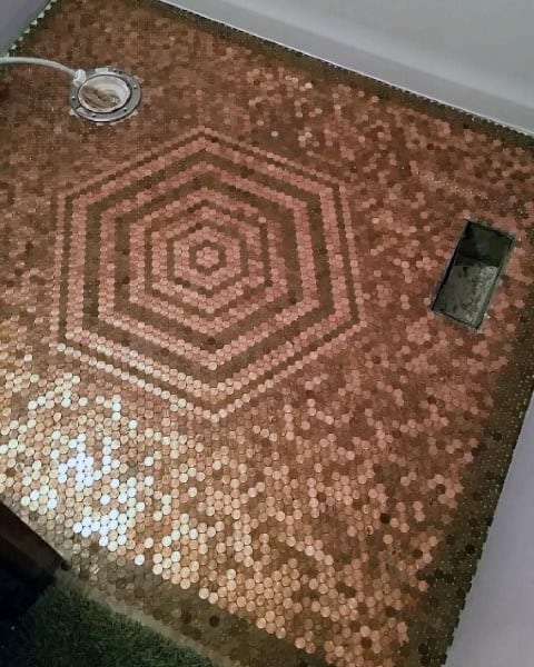 Penny tile floor with a hexagonal pattern design in copper tones and epoxy finish.