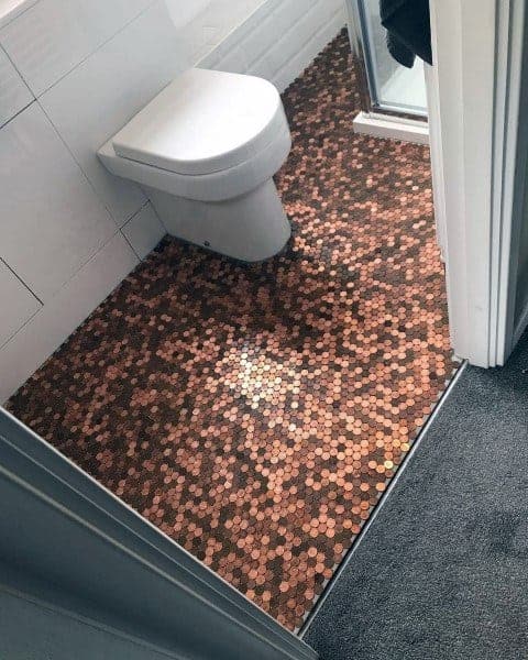 Room with penny tile flooring creating a glossy and unique decorative surface.