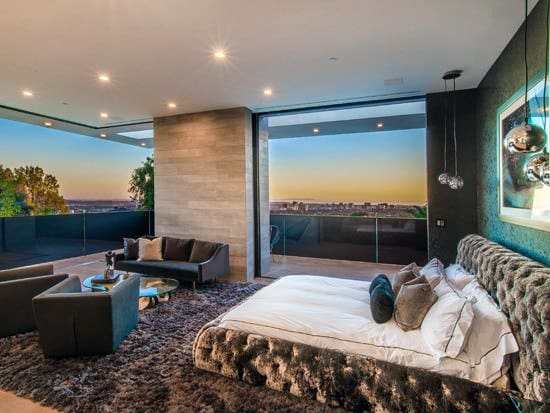 luxury penthouse master bedroom with city views 