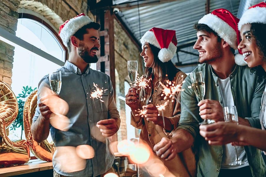 people are celebrating holiday in modern office