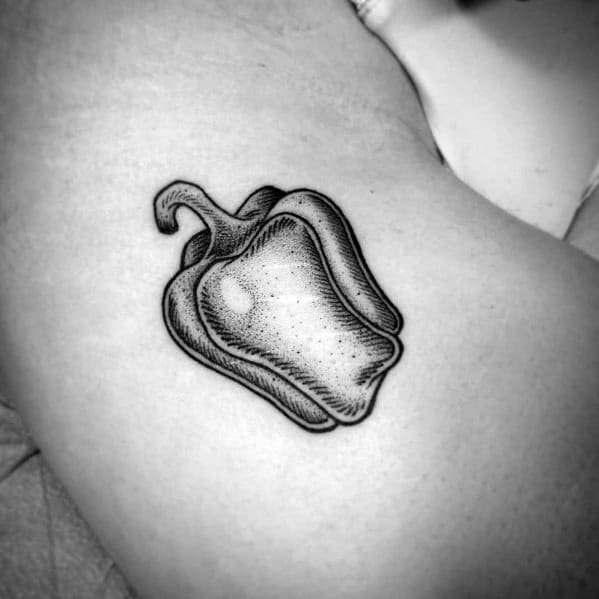 Black and grey bell pepper tattoo with fine dotwork shading, creating a realistic and textured design on the skin.