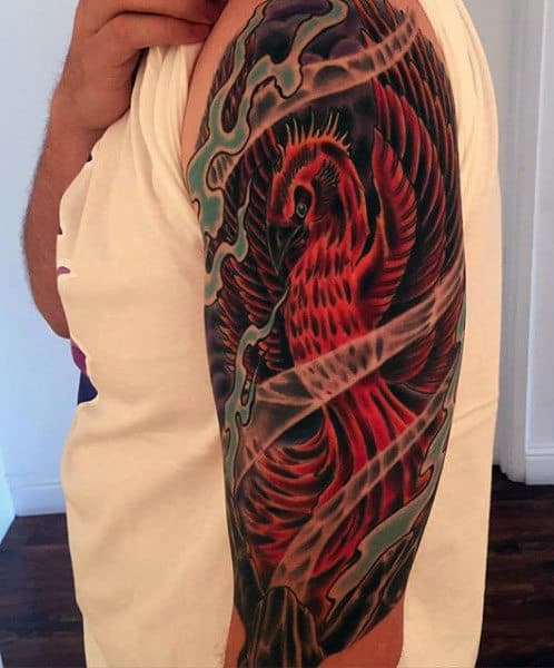 Red Fire Phoenix Ink Tattoo On Man's Arm