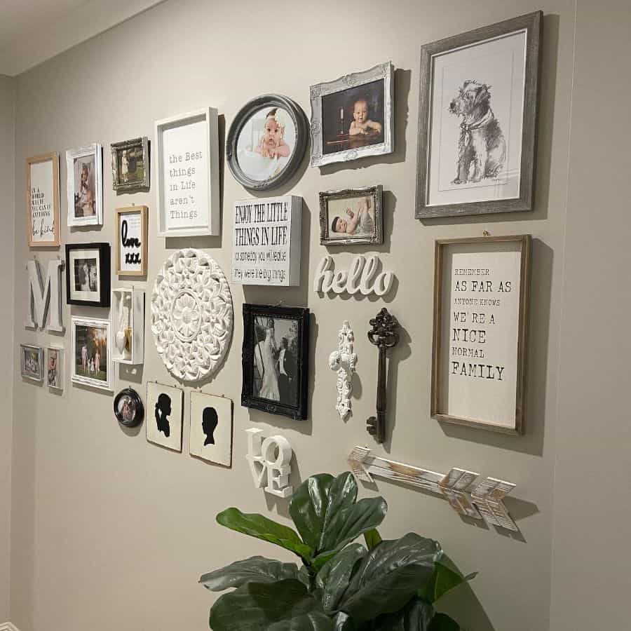 framed photos and wall art on hallway wall