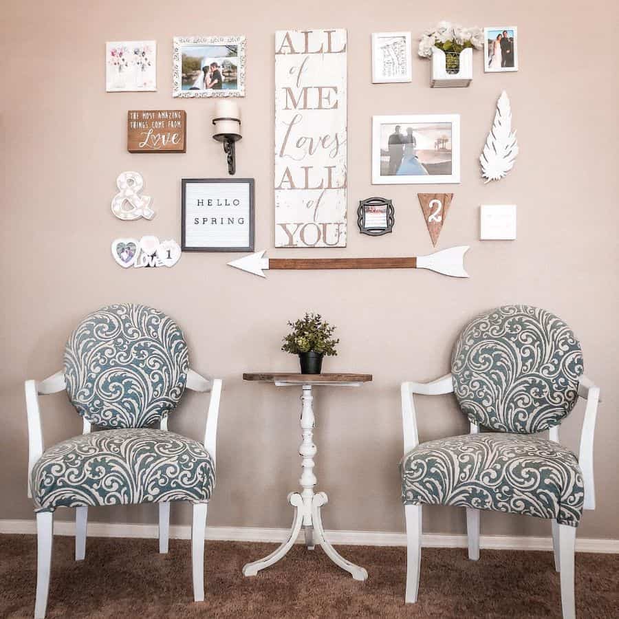 pink wall with interesting wall art and framed photos 