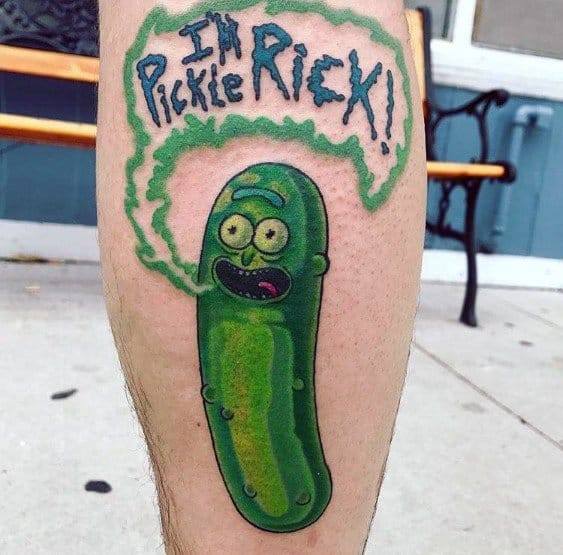 Pickle Rick tattoo with bold green shading, featuring a speech bubble saying 'I'm Pickle Rick!!' in a fun, cartoon-style design on the leg.