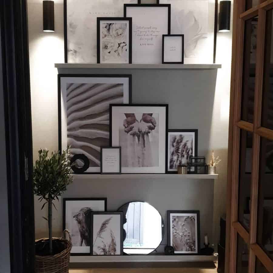 gray shelf with framed pictures 