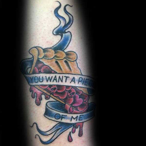 Steaming cherry pie tattoo with a dripping filling and a banner reading “You want a piece of me,” blending humor with a bold traditional style