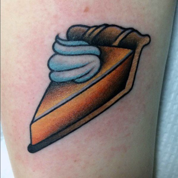 Bold pumpkin pie tattoo with a golden crust, smooth filling, and a swirl of whipped cream, featuring a clean traditional tattoo style