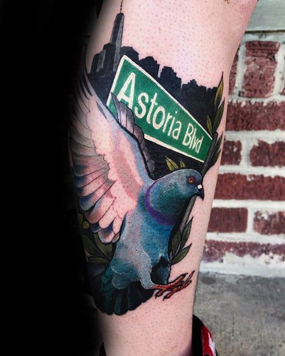Colorful pigeon tattoo with an "Astoria Blvd" sign and NYC skyline, celebrating urban roots, hometown pride, and city life energy.