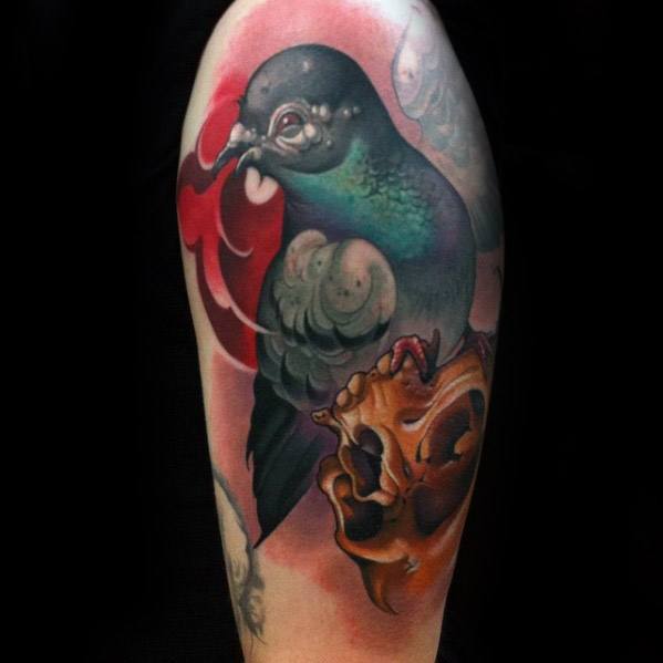 Vivid pigeon tattoo with glowing green chest, red smoke, and realistic skull, blending life and death themes in a bold, surreal style.