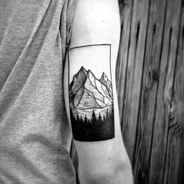 Pine Trees With Mountain Guys Back Of Arm Tattoo