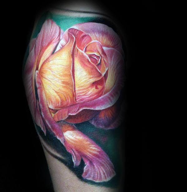 Detailed tattoo of a vibrant pink and orange rose