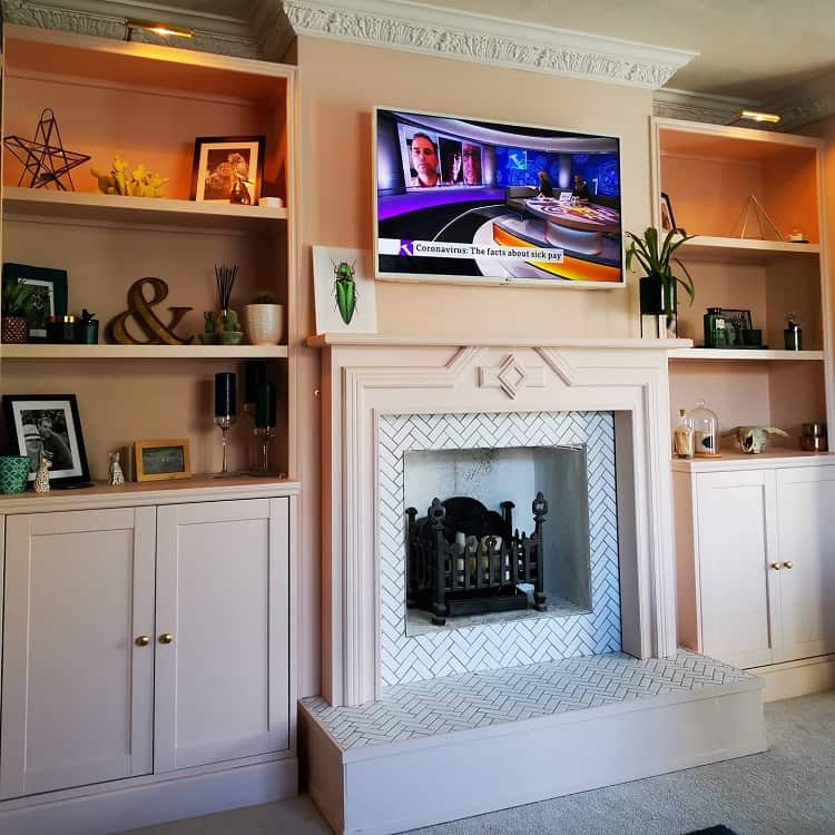 pink shelves and cabinets fireplace mounted tv