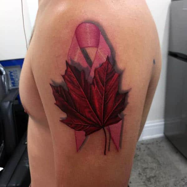 Pink Ribbon With Red Maple Leaf Guys Upper Arm Tattoo