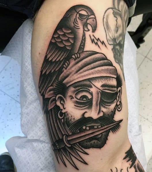 Pirate Themed Tattoo Sleeve On Man's Bicep