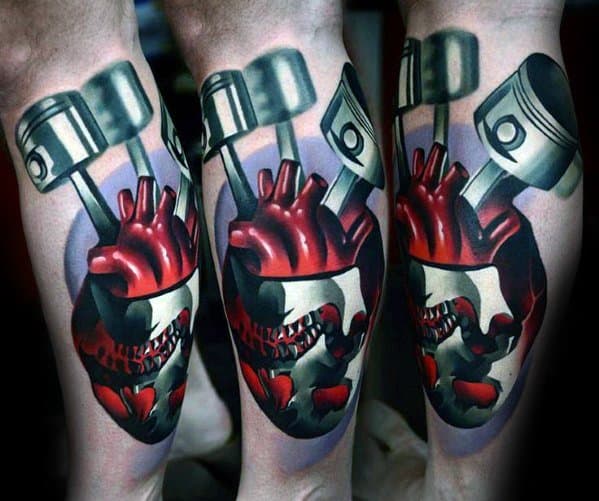 Tattoo of a mechanical heart with gears and pistons, featuring vivid red and black colors on a person's calf