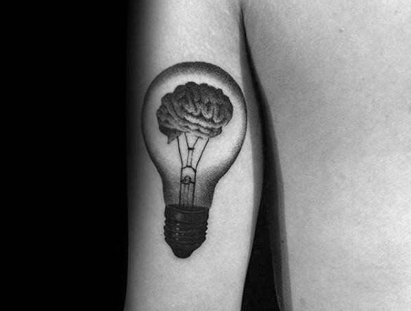 Upper arm tattoo for men featuring a realistic light bulb design with a brain inside, symbolizing creativity and intelligence.